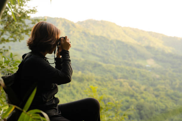 istock Asian senior in tropical mountain forest. 1435198902
