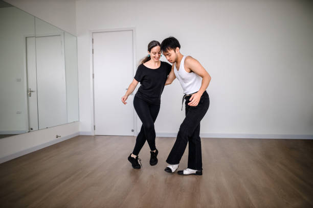 Swing Dancing Partners Practice at Dancing Studio stock photo