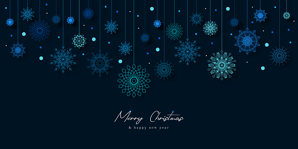 Christmas background with hanging snowflakes with soft shadows on light blue background