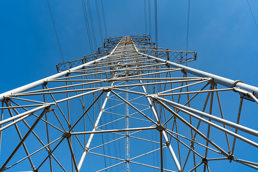 Low angle view of power transmission tower
