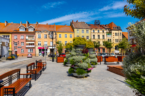 Bartoszyce, Poland - July 13, 2022: Panorama of Constitution square Plac Konstutucji serving as Rynek Market Square in historic old town center of Bartoszyce