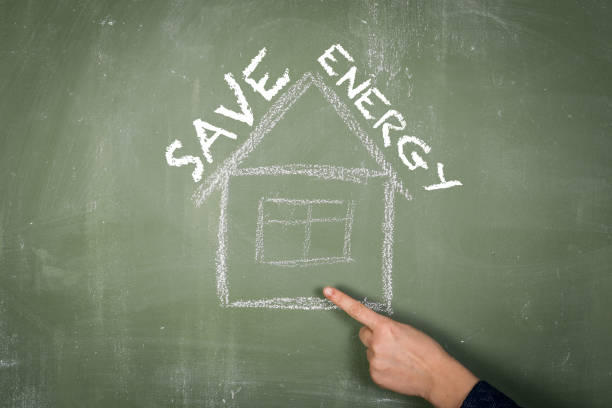 istock Save Energy Concept. Text and illustration on green textured chalkboard 1435215244