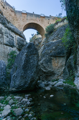 old bridge of ronda,andalucia,spain seen from the guadalevin river