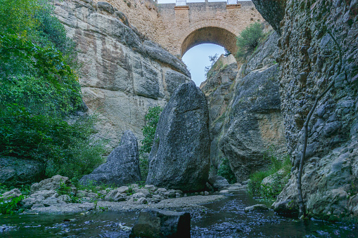 old bridge of ronda,andalucia,spain seen from the guadalevin river
