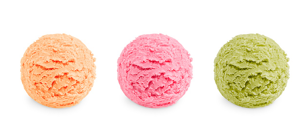 Three colorful scoops of cold sweet ice cream or gelato in assortment of different flavor of pink, green and beige color of vanila, berry and pistachio or mint taste cut out on white backdrop