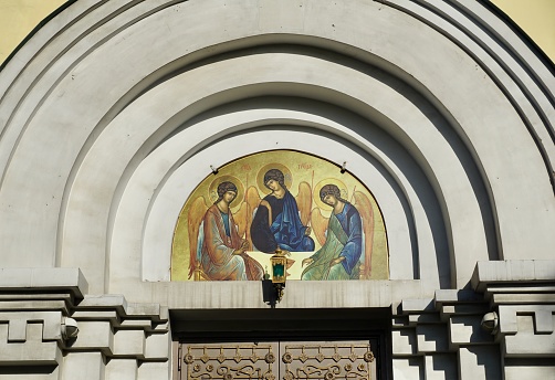 The Intercession Church of the city of Vladivostok on a summer day, cloudy but sunny weather. Christian church in Russia in summer.