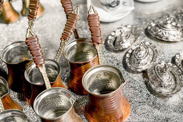 istock Several copper turks for making coffee are on table, top view 1435230869