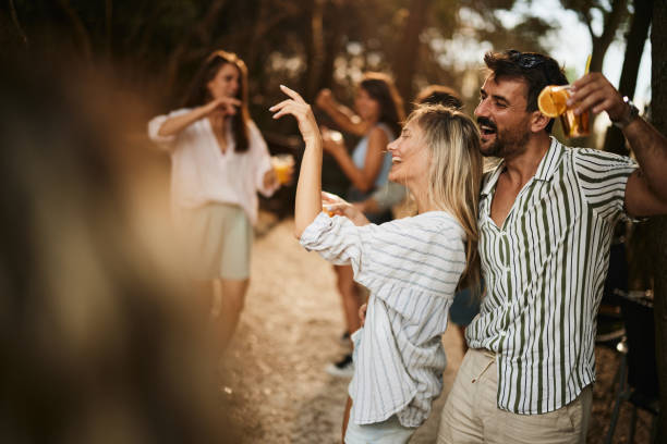 istock Cheerful couple dancing during spring party in nature. 1435230879