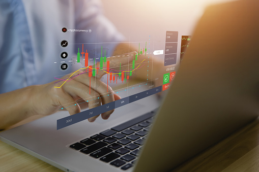 Businessman plans an effective digital stock market analysis strategy showing positive technology charts. Stock growth development ideas, investments, forex, economy, and business success goals.