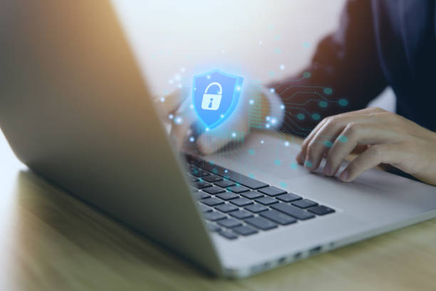 istock Businessman holding a shield icon with a tick mark. computer data password protection concept internet network security Cyber ​​digital technology. Business data and virus protection 1435231530
