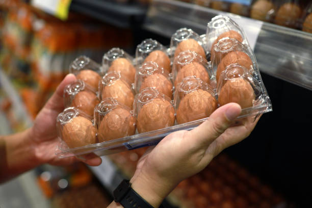 istock Customer buys chicken eggs in grocery store 1435232009