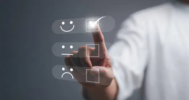 Customer service and Satisfaction concept, Business people touching the virtual screen on the happy Smile face icon to give satisfaction in service. rating very impressed.