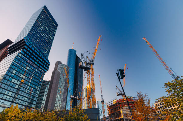 Cranes working on construction site in business district of Frankfurt am Main, expansion near Main Tower and Deutsche bank
