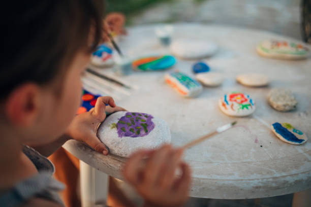 istock An unrecognizable little girl enjoys drawing on stones 1435235210