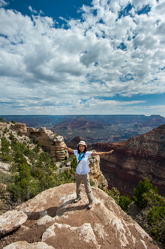 Japanese tourist taking a picture in Brice Canyon.