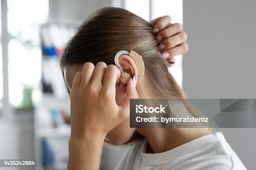 istock Woman wearing a hearing aid 1435242884