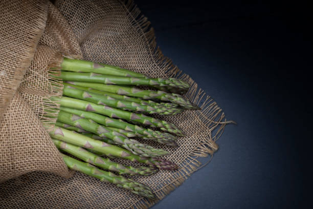 still life with fresh green asparagus stock photo
