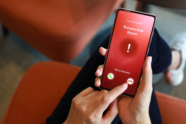 istock Person receiving suspected spam call on smartphone from an unknown caller 1435244113