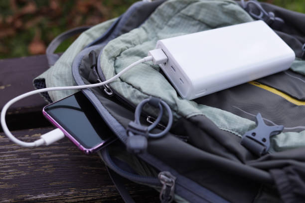 istock Smartphone with power bank on the travel backpack 1435245917