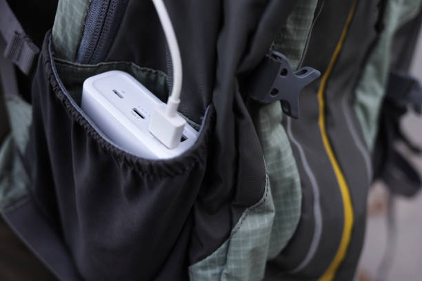 istock Smartphone with power bank on the travel backpack 1435245919