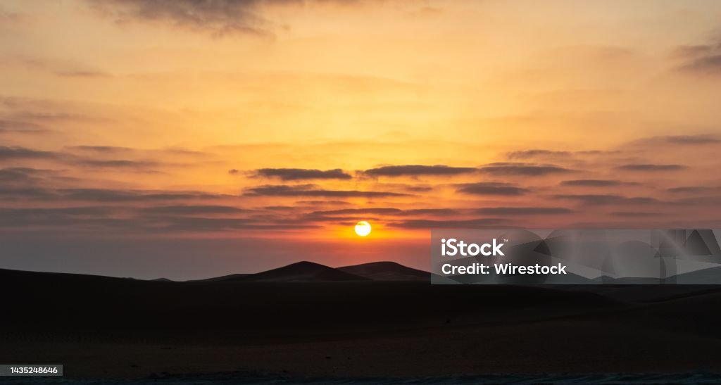 Scenic view of sunset over Liwa Desert in the United Arab Emirates A scenic view of sunset over Liwa Desert in the United Arab Emirates Beauty Stock Photo