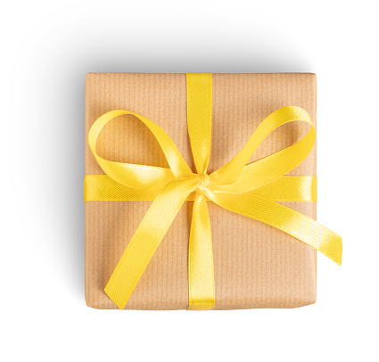 Gift box with yellow ribbon on white. This file is cleaned, retouched and contains clipping path.
