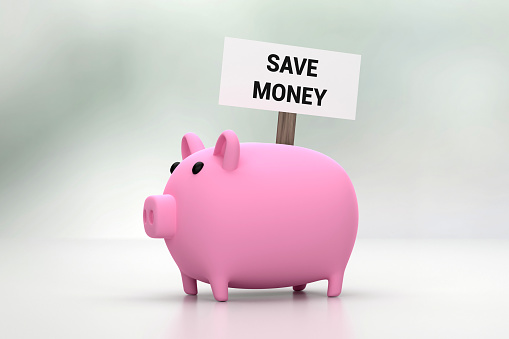 Piggy Bank And Save Money Message On Gray Background. Finance And Economy Concept.