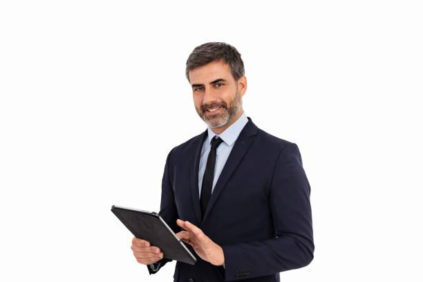 istock Businessman using tablet and looking at camera on white background 1435251494
