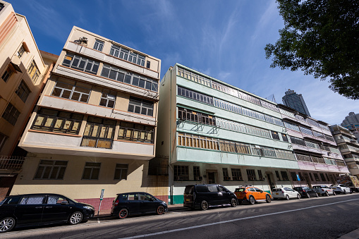 Hong Kong - October 21, 2022 : Residential buildings that will be pulled down and replaced with newer apartments as part of the government's urban renewal project at Shing Tak Street / Ma Tau Chung Road in Kowloon, Hong Kong. The project targeted completion by 2029/2030.
