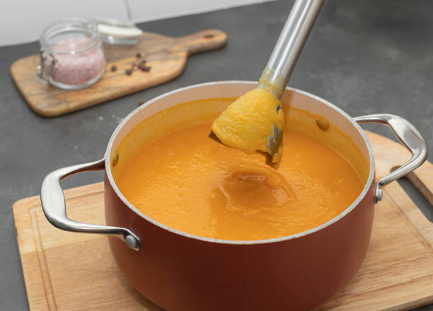 istock cooking pumpkin cream soup using an electric blender 1435255949