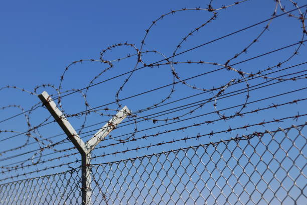istock Net with barbed wire inside the airport. 1435256237