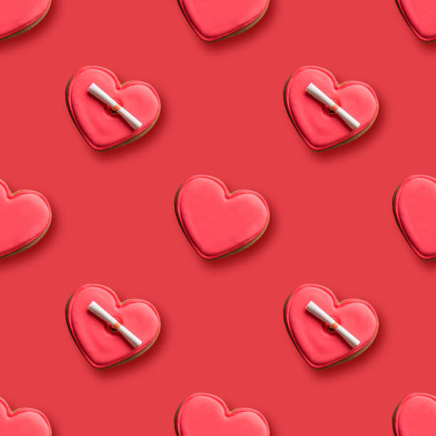 istock Seamless pattern of heart shaped cookies with red glaze on red background. 1435257124