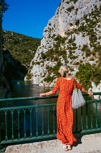 Female tourist on the bridge over the D11 road at Basses Gorge du Verdon near Quinson, Provence, France. This is on the Lower Verdon Gorge over 20km south west of its more famous neighbour.