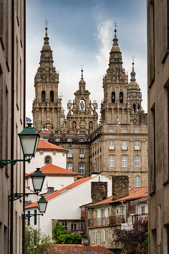 Santiago de Compostela Cathedral from Downtown Santiago de Compostela City Street View. Typical Downtown Buildings and Alley View towards the Santiago de Compostela Cathedral. Santiago de Compostela, Galicia, Spain, Europe