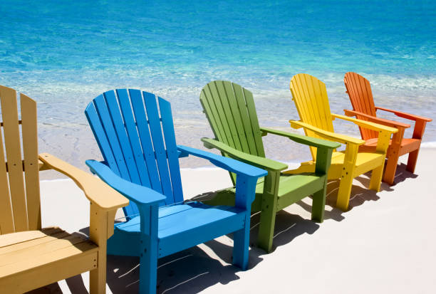 istock Colored wooden chairs on white sand beach 1435259854