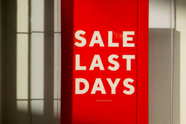 istock Red signboard with discounts and sales. Shopping. 1435259986
