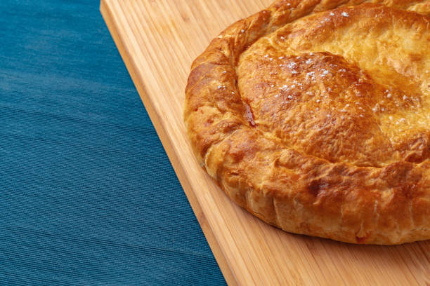 istock Apple pie on a wooden board close up 1435260807