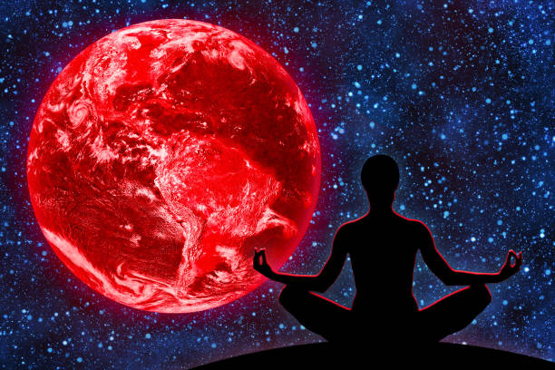 istock Yoga Figure Against Red Earth in Space 1435262922
