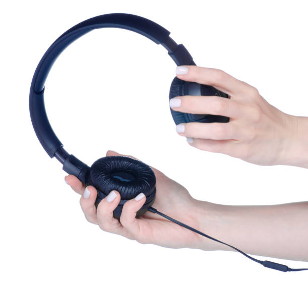 istock Black modern headphones in hand 1435263568