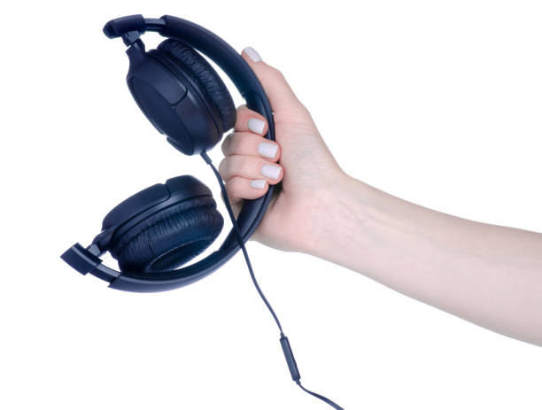istock Black modern headphones in hand 1435263570