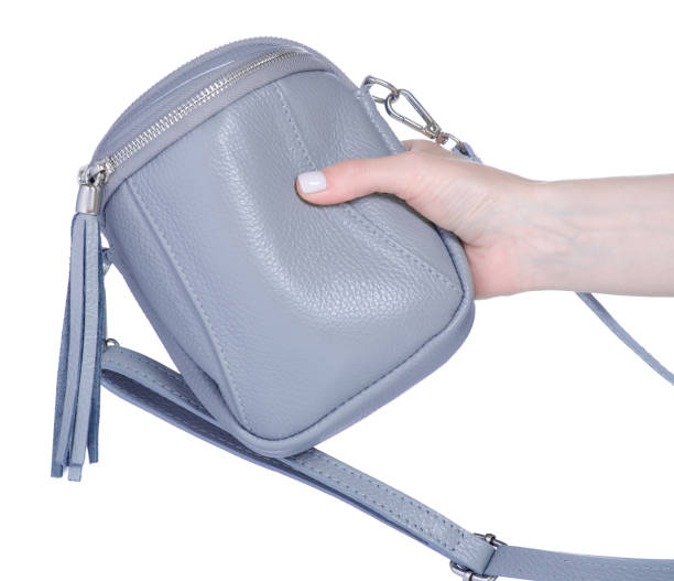 istock Female gray small bag in hand 1435263589