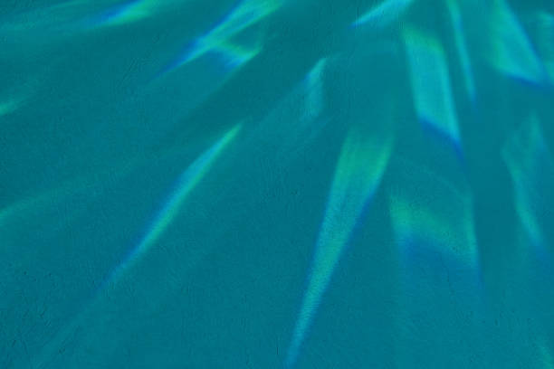 Abstract crystal light glare on turquoise blue concrete texture