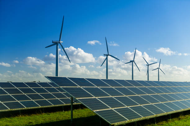 istock Wind turbine and solar panels energy generators on wind farm 1435267443