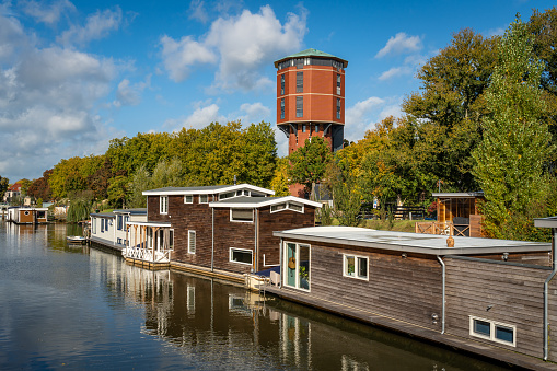 Cityscape of Zwolle with houseboats and renovated historical water tower