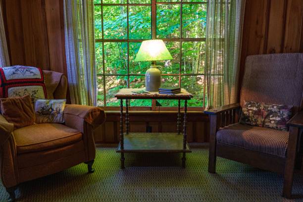 istock Cozy armchairs inside a cabin in a forest 1435273271