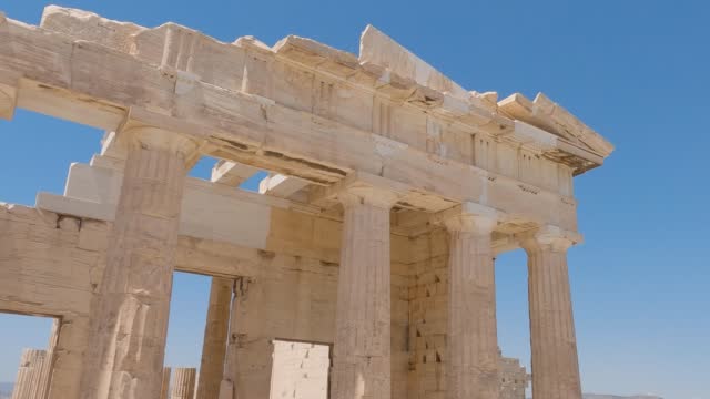 Panning shot of Ancient Propylaea Columns First Acropolis of Athens entrance, Greece