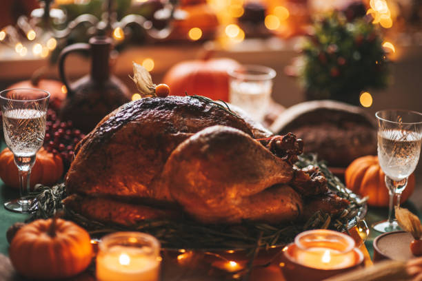 istock Thanksgiving holiday dinner table setting with fall decoration and pumpkins 1435277211