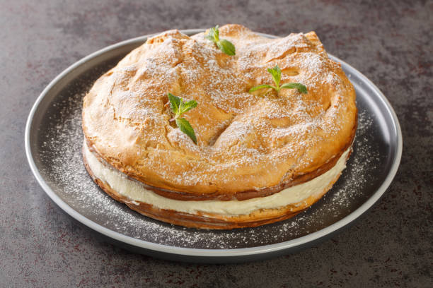 Karpatka is an easy Polish Carpathian cream cake dessert closeup on the plate. Horizontal Karpatka is an easy Polish Carpathian cream cake dessert closeup on the plate on the table. Horizontal deli pie stock pictures, royalty-free photos & images
