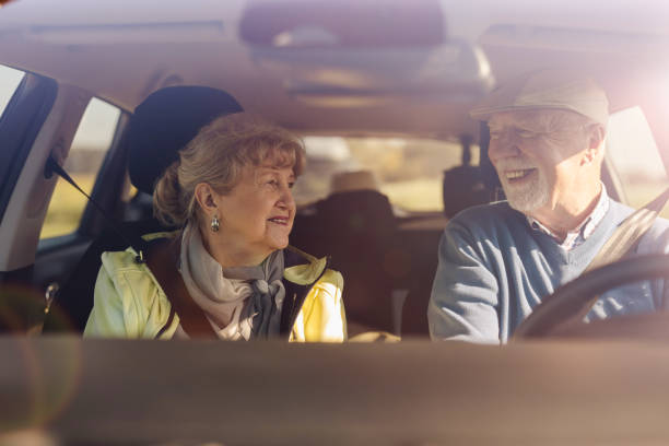 istock Senior couple driving a car 1435280373