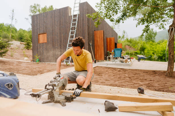 istock Carpenter cutting a wooden plank 1435281506